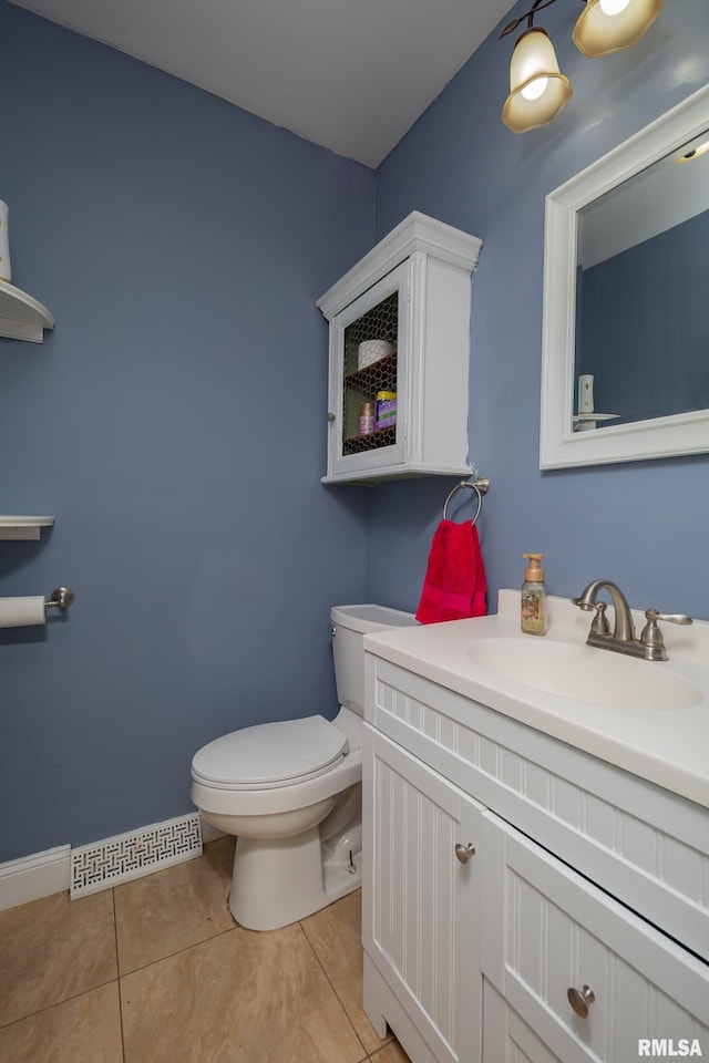 1637 24th Ave, Moline, IL 61265 - bathroom featuring toilet, vanity, and tile patterned flooring
