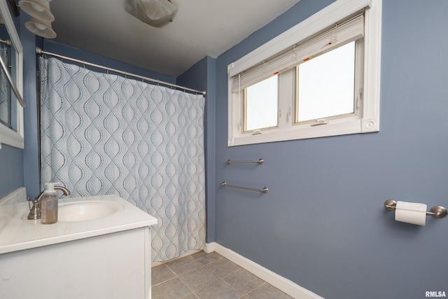 1637 24th Ave, Moline, IL 61265 - bathroom featuring vanity, tile patterned floors, baseboards, and a shower with curtain