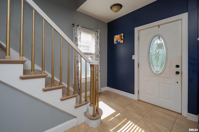 1637 24th Ave, Moline, IL 61265 - entrance foyer featuring stairway, tile patterned floors, and baseboards