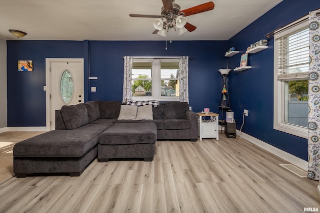 1637 24th Ave, Moline, IL 61265 - living area with a ceiling fan, wood finished floors, and baseboards