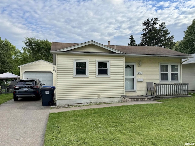 4708 26th Ave, Moline, IL 61265 - view of front facade with driveway, a front lawn, and an outbuilding