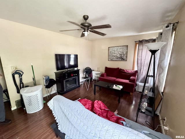 4708 26th Ave, Moline, IL 61265 - living area featuring wood finished floors, a ceiling fan, and baseboards