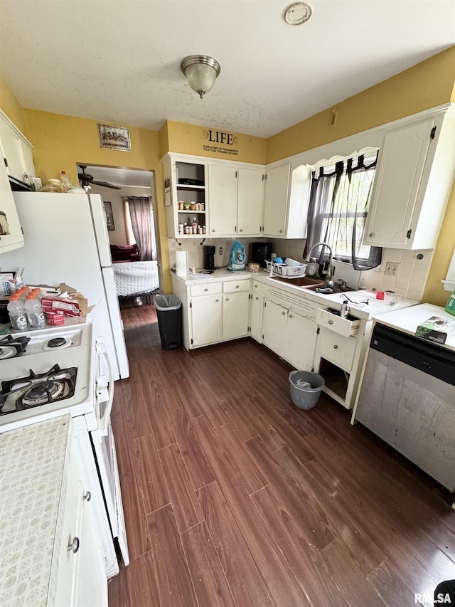 4708 26th Ave, Moline, IL 61265 - kitchen with dark wood-type flooring, white cabinets, and light countertops