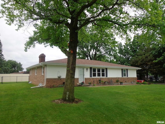 2228 N Sheridan Dr, Quincy, IL 62305 - single story home with brick siding and a chimney