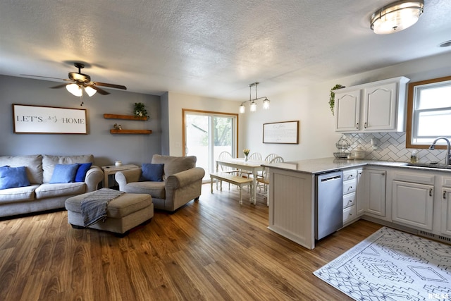 414 11th Avenue A Court, Silvis, IL 61282 - living room featuring a ceiling fan, wood finished floors, and a textured ceiling
