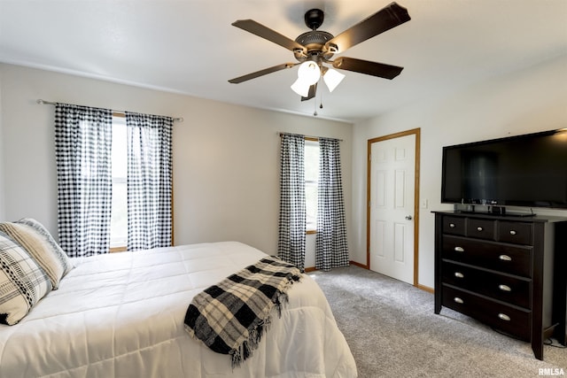 414 11th Avenue A Court, Silvis, IL 61282 - bedroom featuring light carpet, a ceiling fan, and baseboards
