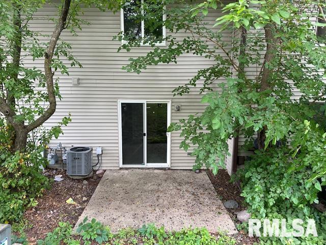 4015 Lillie Ave Unit 106, Davenport, IA 52806 - back of house featuring central air condition unit and a patio area