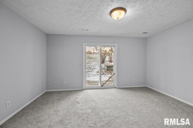 4015 Lillie Ave Unit 106, Davenport, IA 52806 - empty room featuring carpet flooring, baseboards, and a textured ceiling