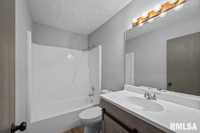 4015 Lillie Ave Unit 106, Davenport, IA 52806 - full bathroom featuring toilet, vanity, a textured ceiling, shower / bath combination, and wood finished floors