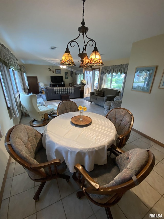 904 W Main St, Reynolds, IL 61279 - tiled dining room featuring baseboards