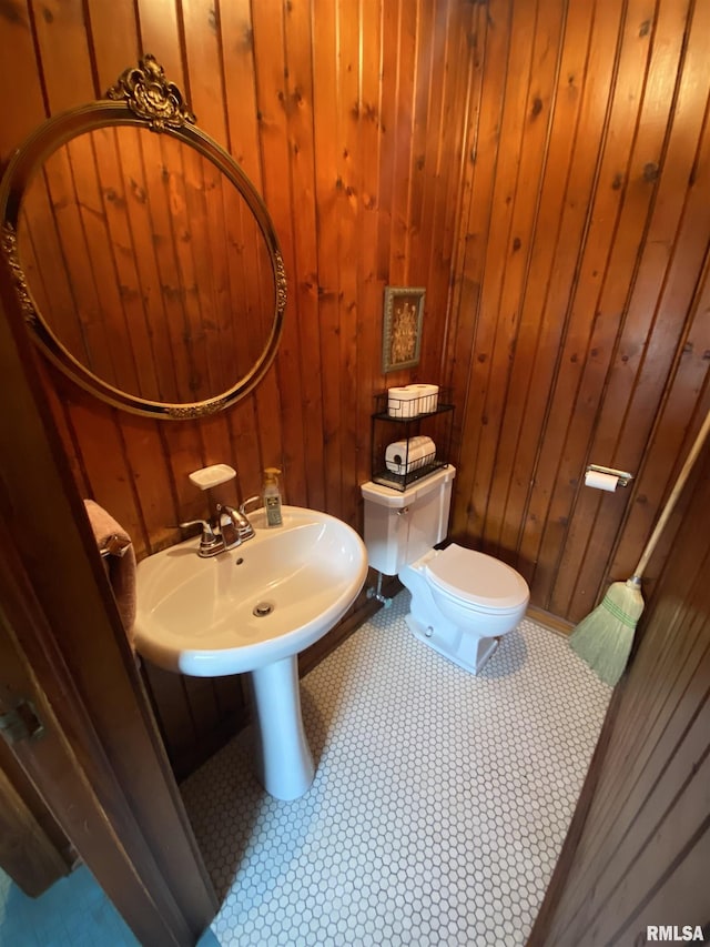 904 W Main St, Reynolds, IL 61279 - half bathroom featuring toilet and wooden walls