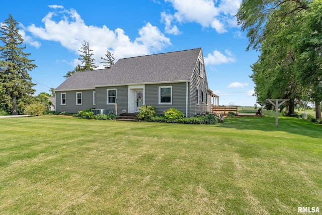 904 W Main St, Reynolds, IL 61279 - cape cod house featuring a front yard, roof with shingles, and central AC