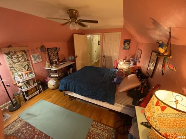 904 W Main St, Reynolds, IL 61279 - bedroom with vaulted ceiling, wood finished floors, and ceiling fan