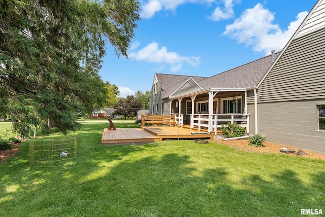 904 W Main St, Reynolds, IL 61279 - view of grassy yard featuring a deck