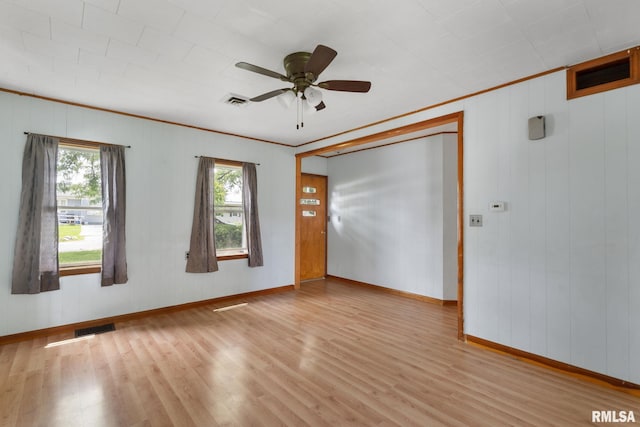 1323 113th Ave, Milan, IL 61264 - unfurnished room featuring wood finished floors, baseboards, crown molding, and a ceiling fan