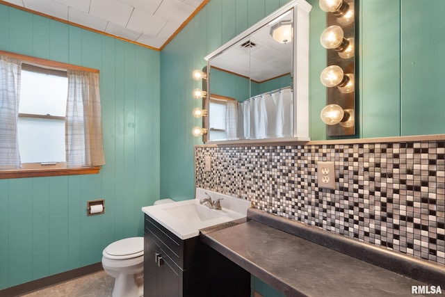 1323 113th Ave, Milan, IL 61264 - bathroom with backsplash, vanity, toilet, and crown molding
