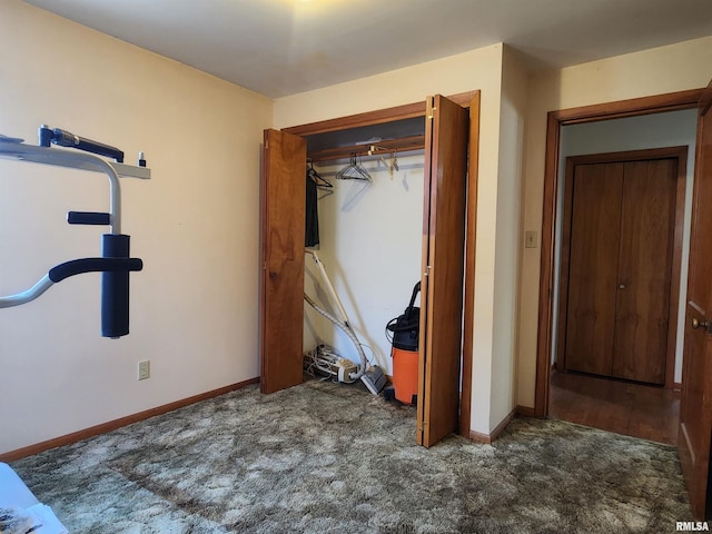 119 9th Ave, Camanche, IA 52730 - unfurnished bedroom with carpet floors, a closet, and baseboards