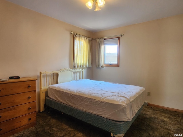 119 9th Ave, Camanche, IA 52730 - bedroom featuring dark colored carpet
