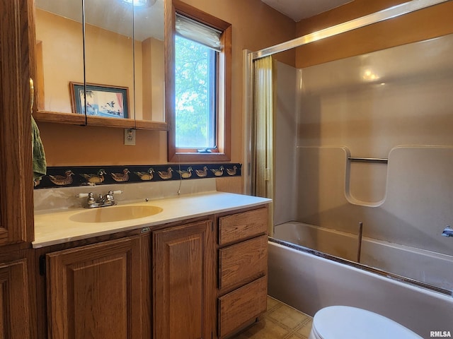 119 9th Ave, Camanche, IA 52730 - bathroom with vanity, toilet, and combined bath / shower with glass door
