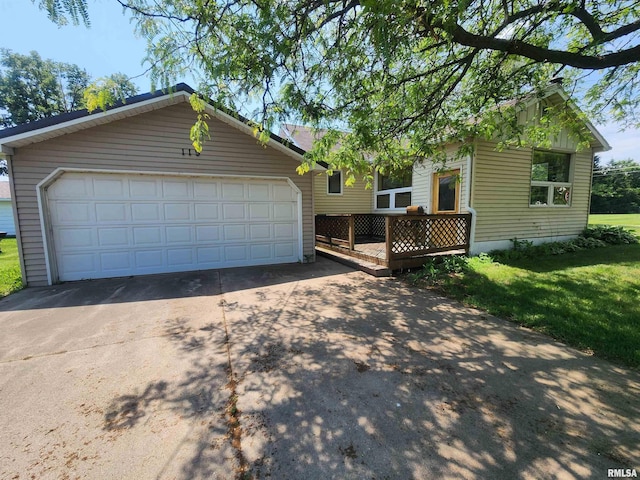 119 9th Ave, Camanche, IA 52730 - view of front of home featuring a deck and a front lawn