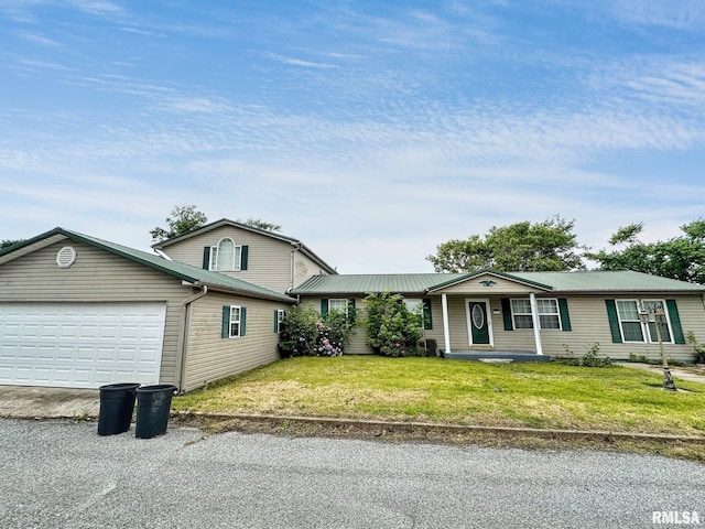 52 Chickasaw St, Mcclure, IL 62957 - view of front facade featuring an attached garage, driveway, and a front yard