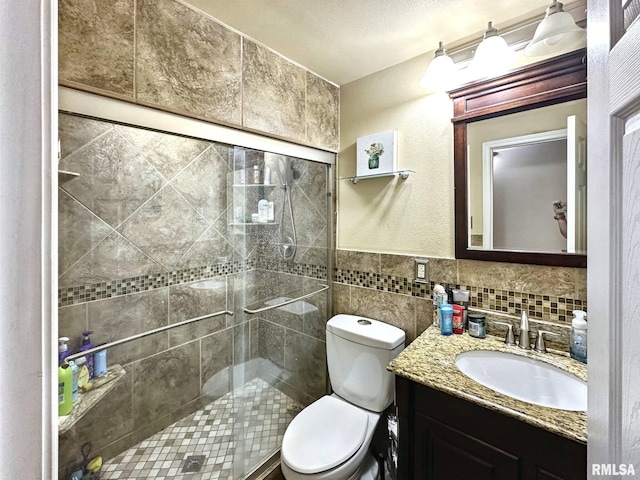 52 Chickasaw St, Mcclure, IL 62957 - full bath with vanity, a shower stall, and tile walls