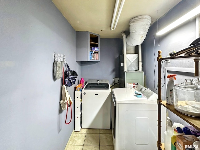 52 Chickasaw St, Mcclure, IL 62957 - washroom with washer and dryer and light tile patterned floors