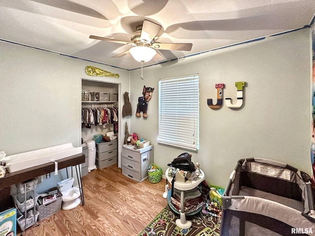 52 Chickasaw St, Mcclure, IL 62957 - bedroom with light wood-style floors, a closet, and a ceiling fan