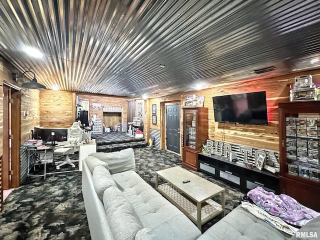 52 Chickasaw St, Mcclure, IL 62957 - living area featuring a desk, wooden walls, and carpet flooring