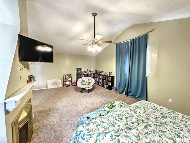 52 Chickasaw St, Mcclure, IL 62957 - carpeted bedroom featuring lofted ceiling, a ceiling fan, and a fireplace