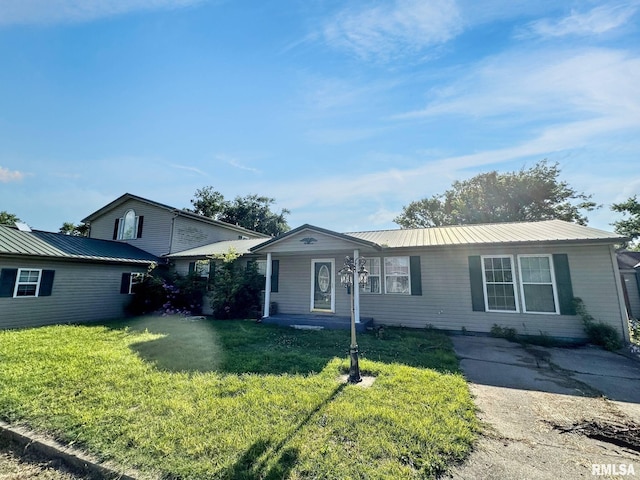 52 Chickasaw St, Mcclure, IL 62957 - view of front of property with a front yard and a metal roof