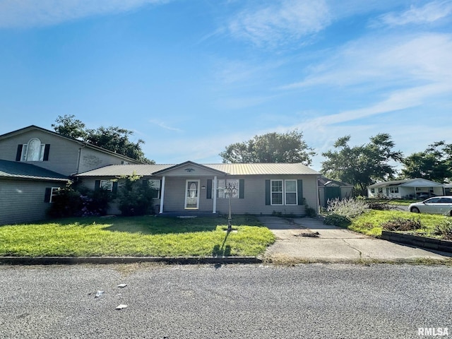 52 Chickasaw St, Mcclure, IL 62957 - ranch-style home featuring a front lawn and a metal roof