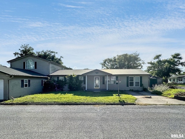 52 Chickasaw St, Mcclure, IL 62957 - single story home with a metal roof and a front yard