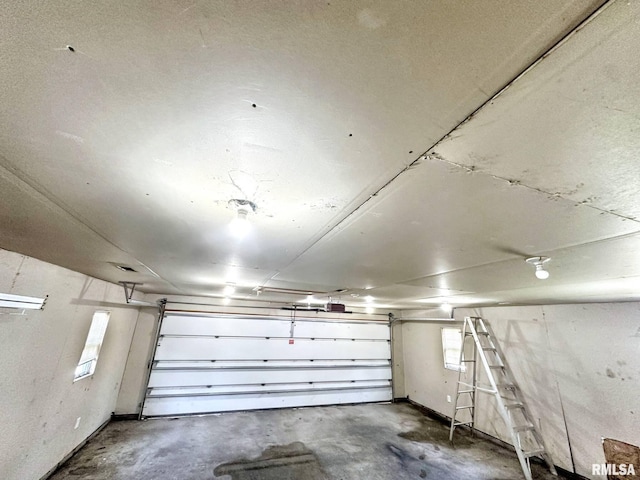 52 Chickasaw St, Mcclure, IL 62957 - garage featuring a garage door opener