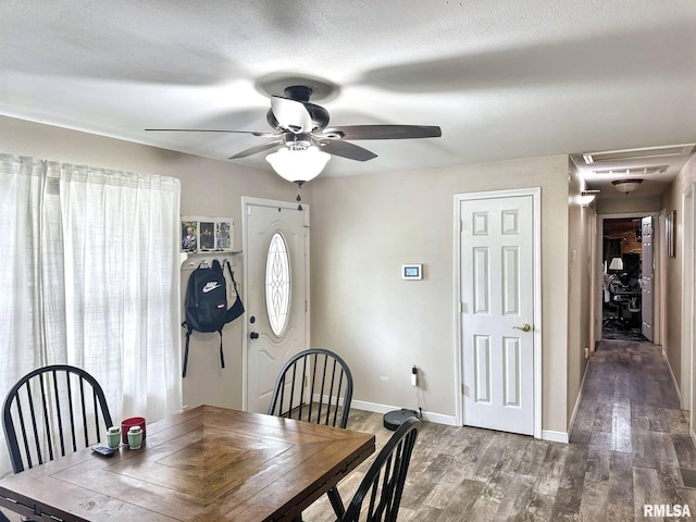 52 Chickasaw St, Mcclure, IL 62957 - dining area with a ceiling fan, wood finished floors, and attic access