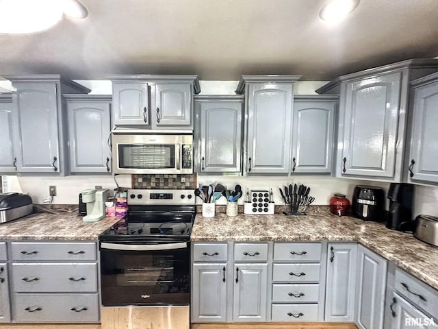 52 Chickasaw St, Mcclure, IL 62957 - kitchen featuring stainless steel appliances and gray cabinetry