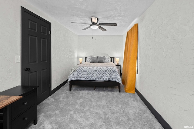 2400 24th St, Rock Island, IL 61201 - bedroom with a textured wall, a textured ceiling, carpet flooring, baseboards, and ceiling fan