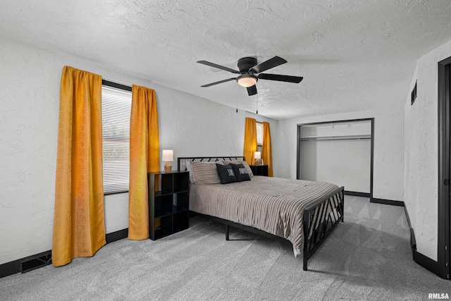 2400 24th St, Rock Island, IL 61201 - bedroom with a textured wall, carpet, a textured ceiling, baseboards, and a ceiling fan