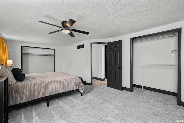 2400 24th St, Rock Island, IL 61201 - bedroom featuring carpet floors, baseboards, a textured ceiling, and ceiling fan