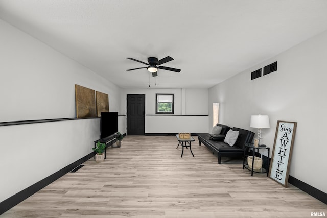 2400 24th St, Rock Island, IL 61201 - living area with light wood-style flooring, a ceiling fan, and baseboards