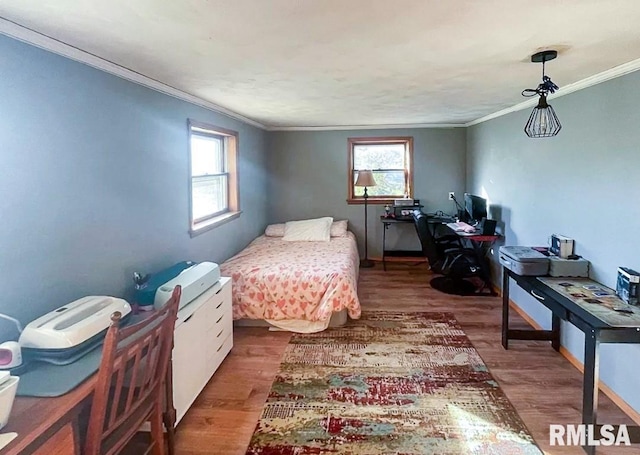 1436 Main Ave, Clinton, IA 52732 - bedroom with ornamental molding, wood finished floors, multiple windows, and an office area