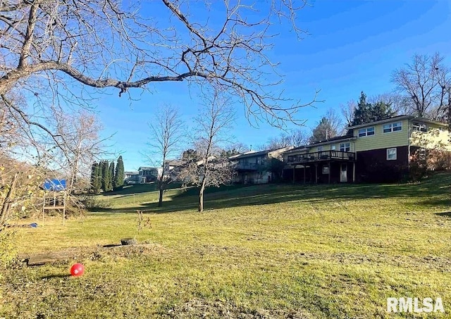 1436 Main Ave, Clinton, IA 52732 - view of grassy yard with a wooden deck