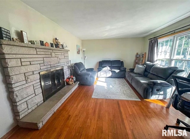 1436 Main Ave, Clinton, IA 52732 - living area with hardwood / wood-style floors and a stone fireplace