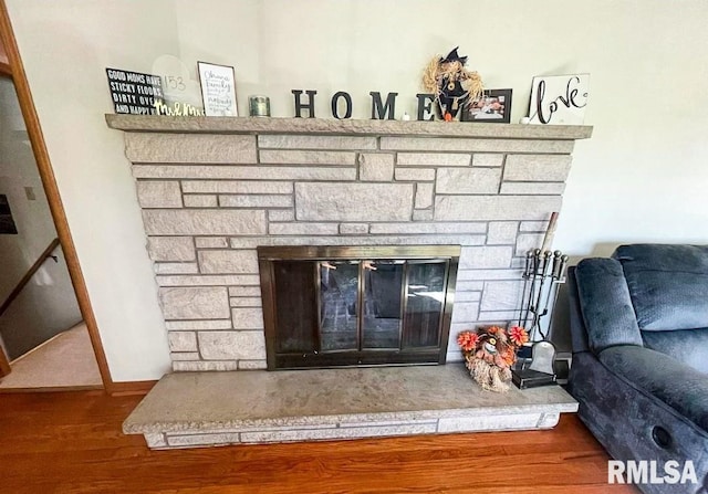 1436 Main Ave, Clinton, IA 52732 - detailed view of a stone fireplace and wood finished floors