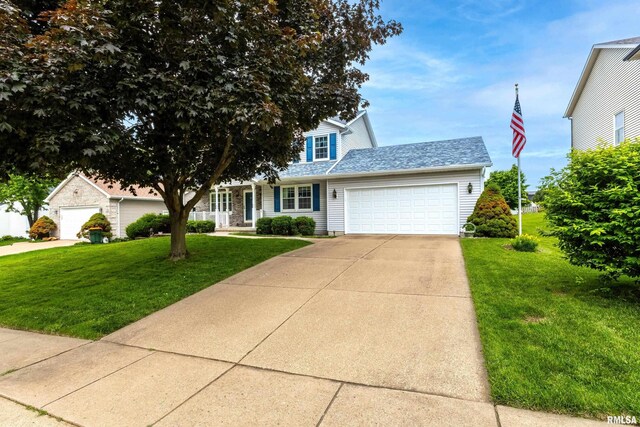 4612 Marquette St, Davenport, IA 52806 - traditional-style home featuring an attached garage, a front lawn, and concrete driveway