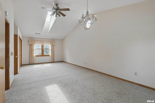 4612 Marquette St, Davenport, IA 52806 - empty room with a ceiling fan, a skylight, light colored carpet, vaulted ceiling, and a chandelier
