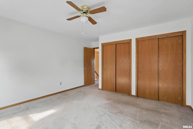 4612 Marquette St, Davenport, IA 52806 - unfurnished bedroom with two closets, carpet floors, and baseboards