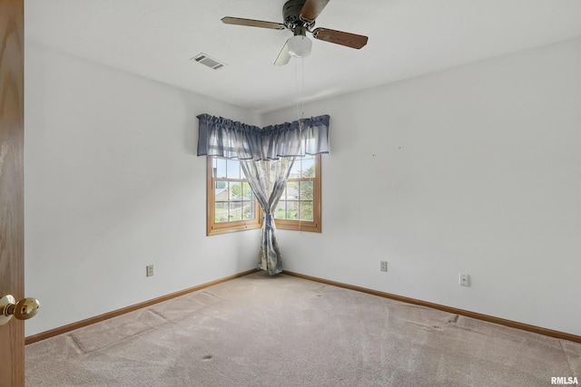 4612 Marquette St, Davenport, IA 52806 - carpeted spare room with baseboards and a ceiling fan
