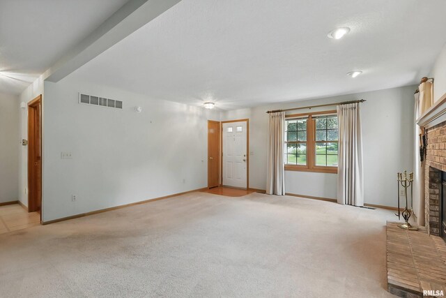 4612 Marquette St, Davenport, IA 52806 - unfurnished living room featuring a fireplace, light carpet, and baseboards