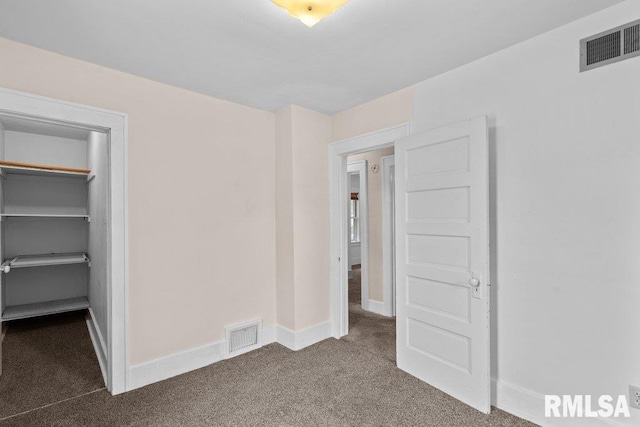 546 21st Ave, Moline, IL 61265 - unfurnished bedroom with carpet, baseboards, and a spacious closet